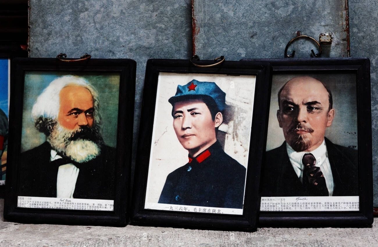 Portraits of Marx, Mao, and Lenin at a street stall